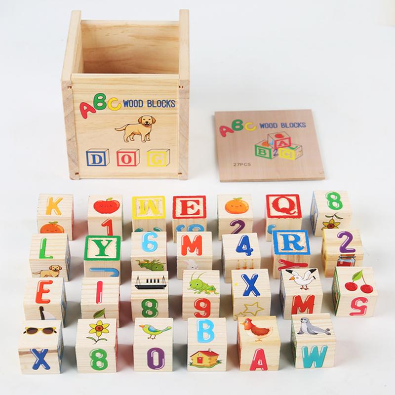ABC blocks laid out with storage box and lid