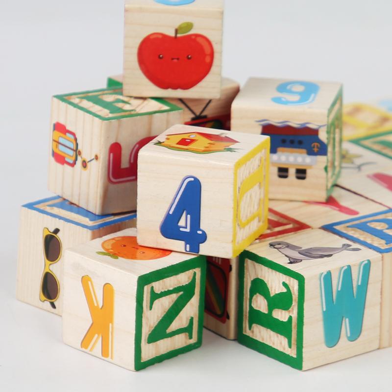 Close-up of colourful letters numbers and pictures on wooden blocks