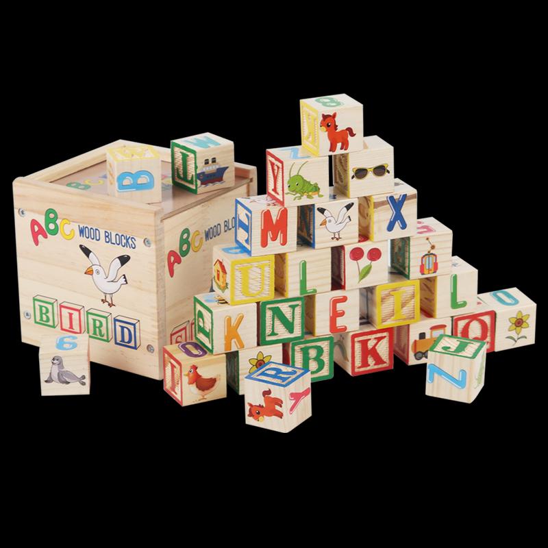 ABC blocks and storage box against a black background